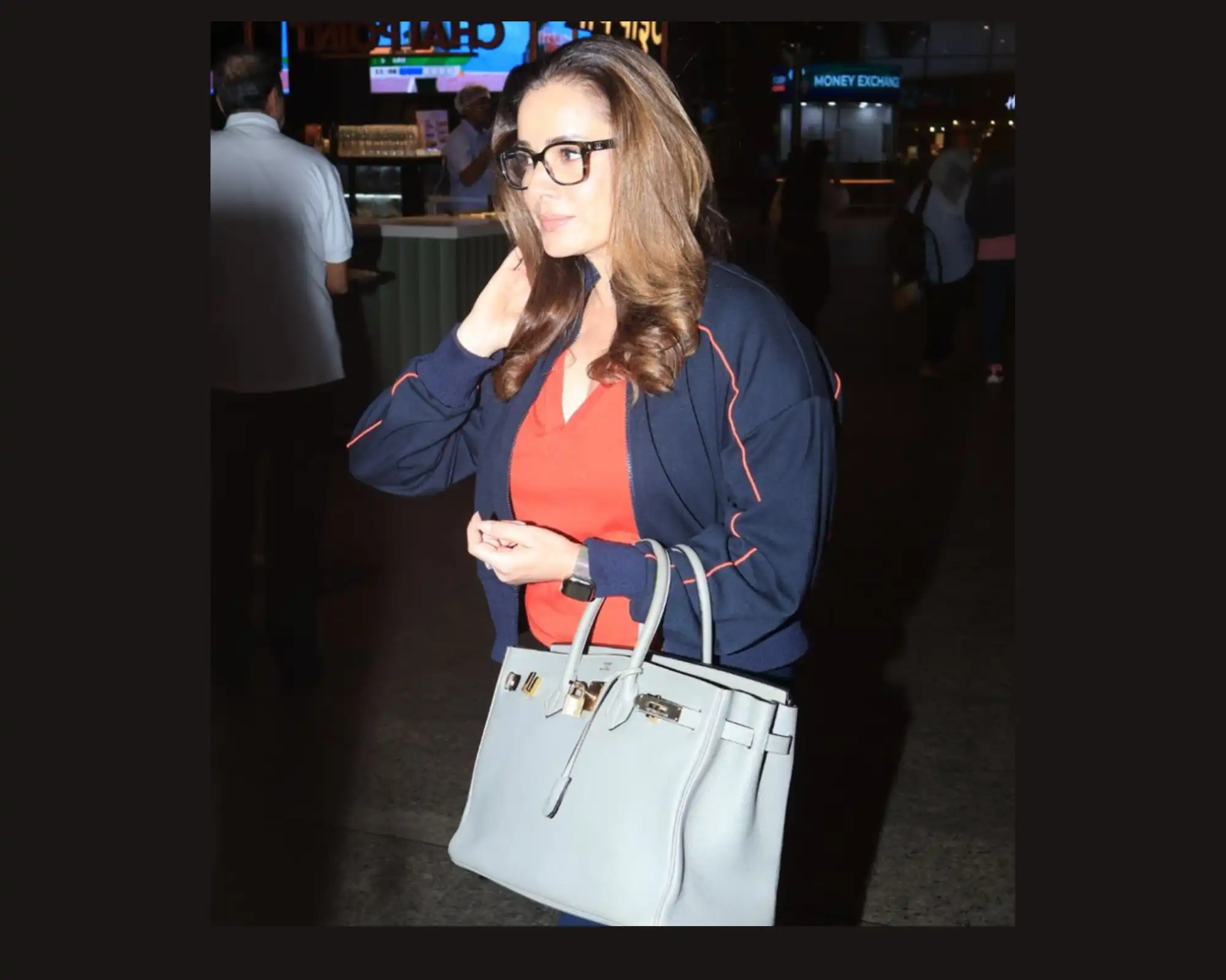 Neelam Kothari Stuns at the Airport with a INR30 Lakh Hermes Birkin Bag